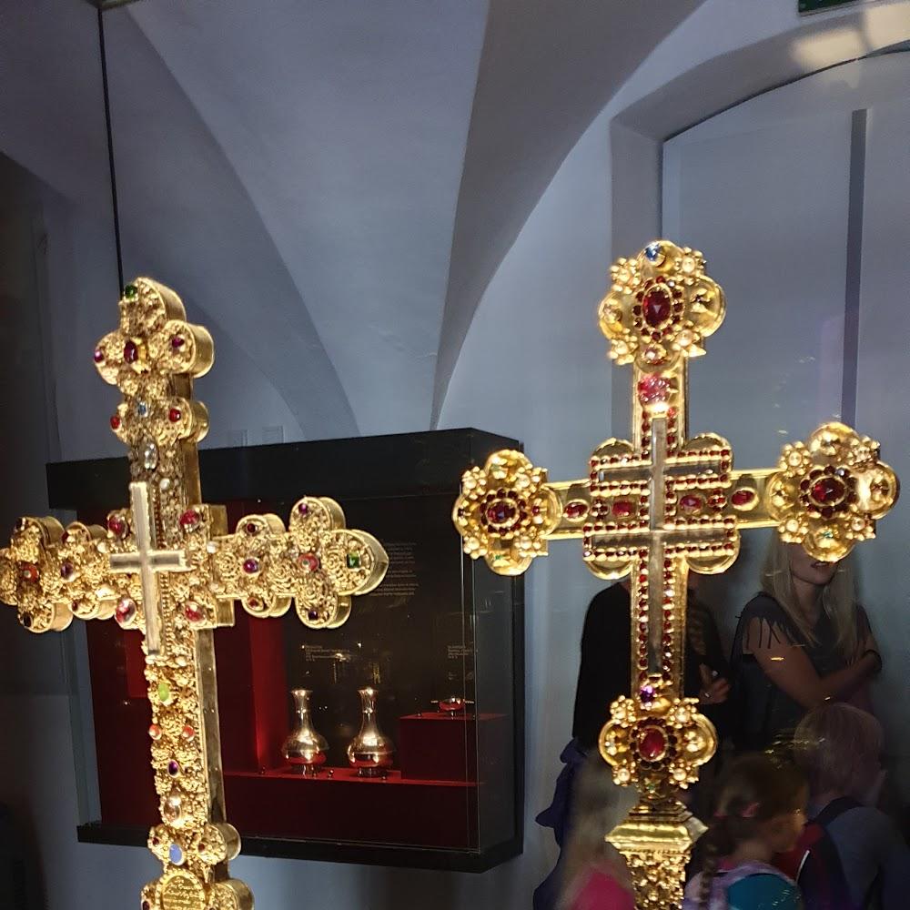 Two ornate golden crosses with jeweled embellishments.  St. Vitus Cathedral.